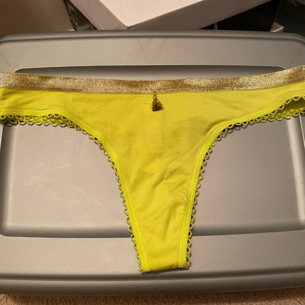 Mustard green and gold thong.